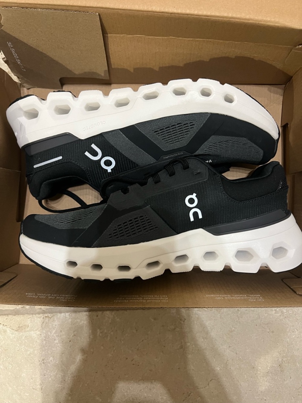 On Running OnCloud Cloudrunner Women's Athletic Shoes in Black/White